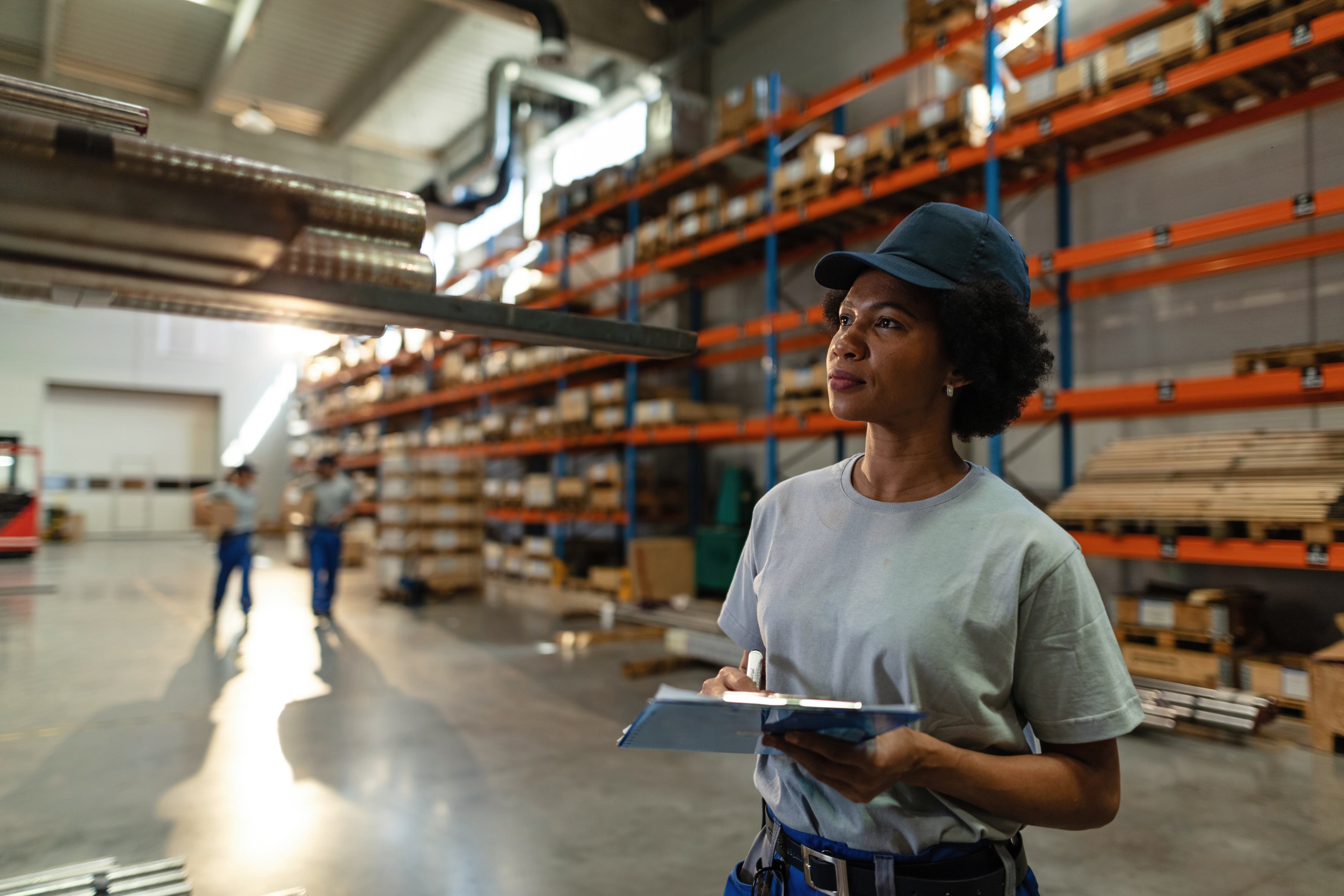 Teria team member reviewing products in a warehouse